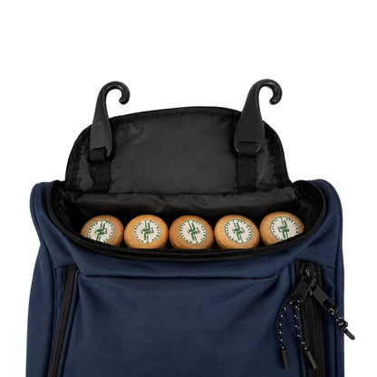 The open top of a navy blue bat bag with five bat knobs lined up inside a black compartment and two black hooks rising from the top edge, on a white background.