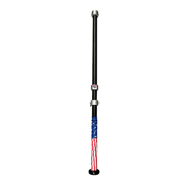 The G Tee Click Stick photographed on a black background.