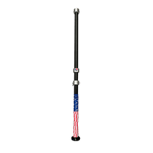The G Tee Click Stick photographed on a black background.