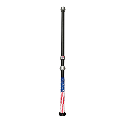 The G Tee Click Stick photographed on a black background.