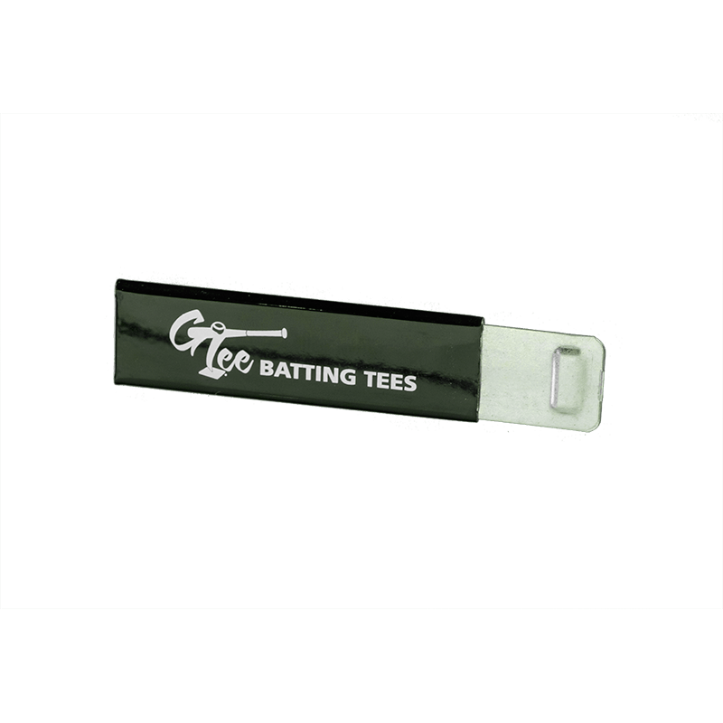The G Tee cup cutter, a slim black tool with a printed label, on a black background.