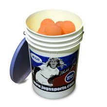 A bucket of orange JUGS low impact multi-use practice softballs with its lid, photographed on a white background.