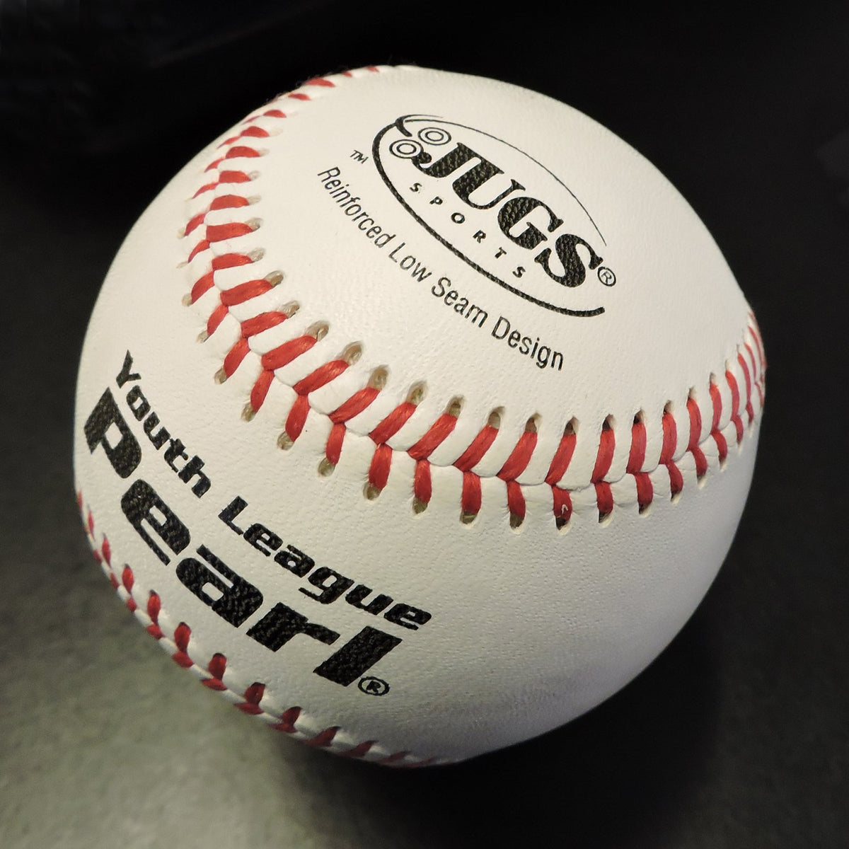 Close-up of a JUGS Youth League Pearl baseball showing its reinforced low seam design.