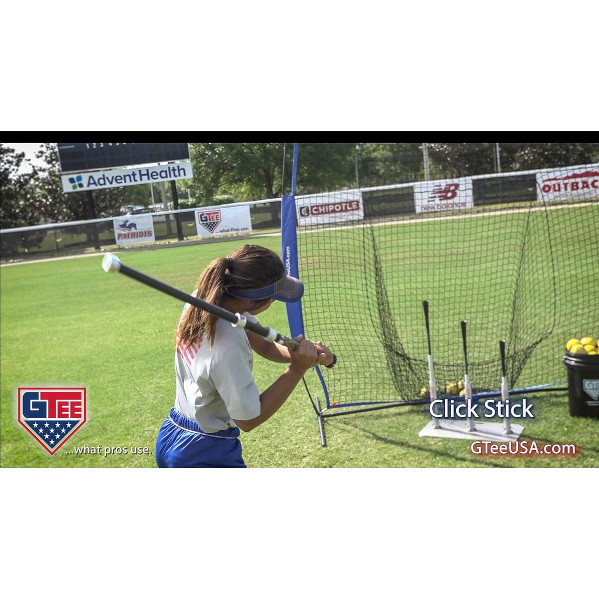 A player using the G Tee Click Stick on a practice field, with G Tee branding across the frame.