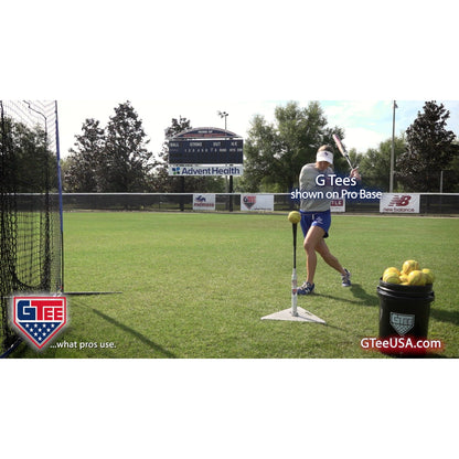 A player using the G Tee Pro Batting Tee on a practice field, with G Tee branding across the frame.
