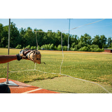 A player using the G Tee Strike Zone on a practice field, with G Tee branding across the frame.