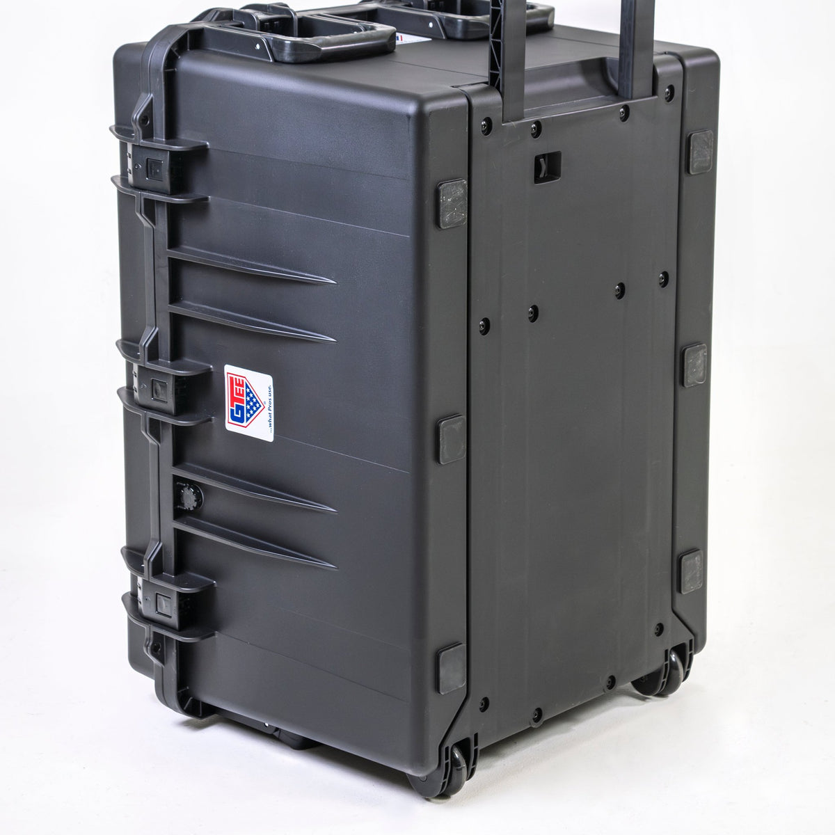 The closed transport case from the front, latches running across the seam.