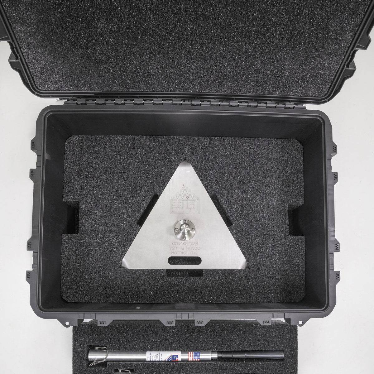 The transport case standing open, showing the moulded foam tray inside the lid.