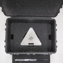 The transport case standing open, showing the moulded foam tray inside the lid.