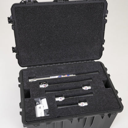 The transport case open with tee uprights and fittings seated in their foam cutouts.
