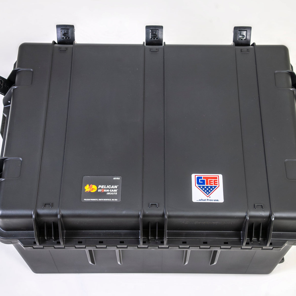 The transport case seen from above, closed, with the hinges along the back edge.