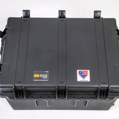 The transport case seen from above, closed, with the hinges along the back edge.