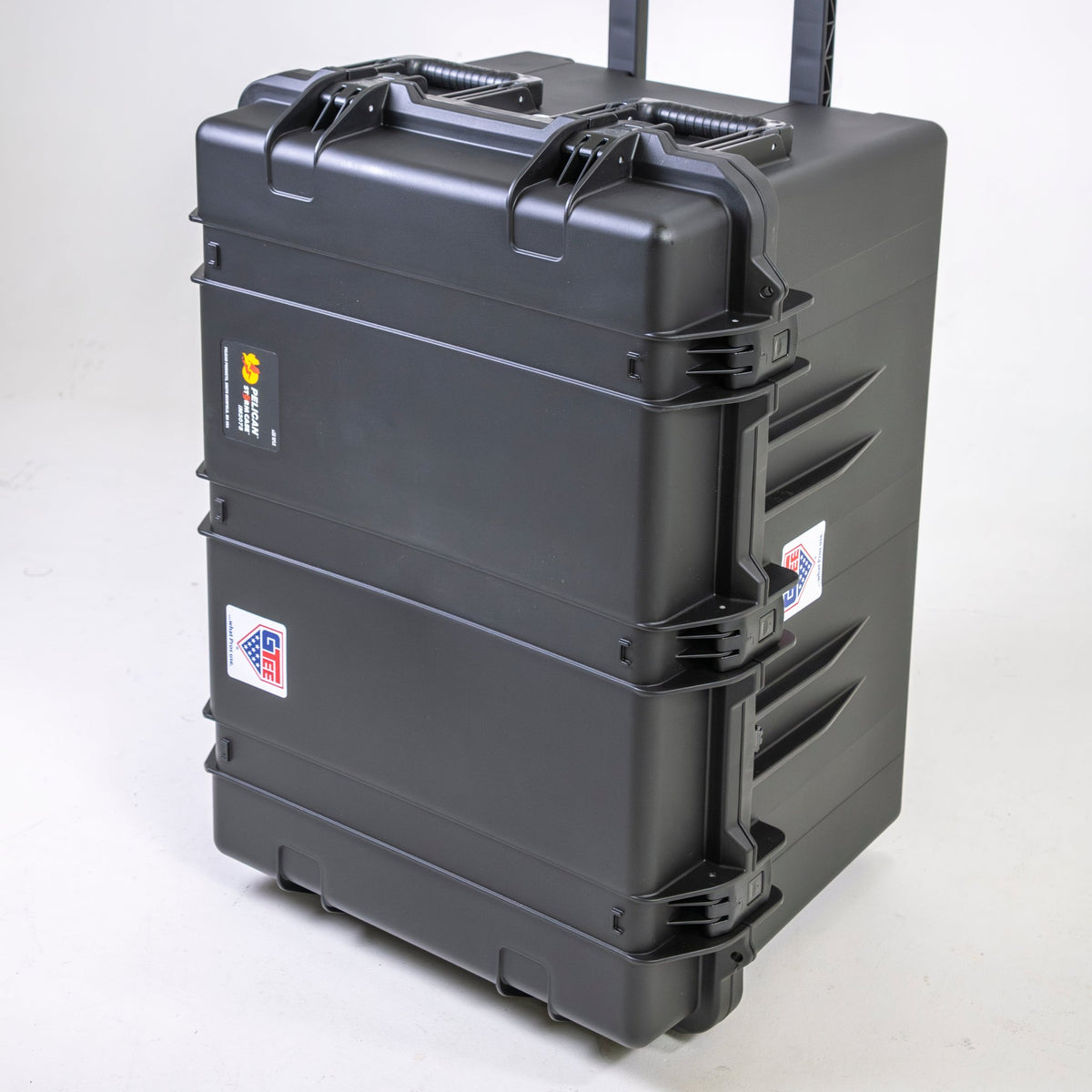 The closed transport case standing upright on its in-line wheels.