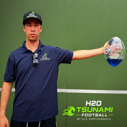 Player holding the H2O Tsunami Football out at shoulder height with the arm extended to the side