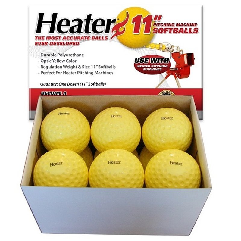 An open Heater 11 inch pitching machine softballs box holding yellow dimpled softballs, with red and black print on the lid.