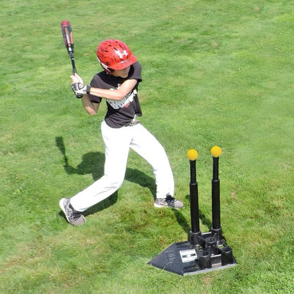 A young baseball player hitting off the JUGS 5-Point Hitting Tee on a grass field.