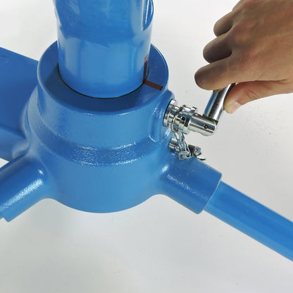 A hand tightening the swivel lock on the base column of the JUGS BP3 softball machine, photographed on a white background.