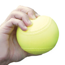 A hand holding a bright yellow practice softball with molded seams, on a white background.