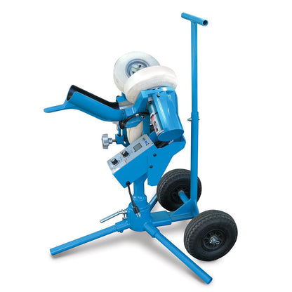 The JUGS mini3 softball pitching machine mounted on its transport cart with two black wheels and a T-handle, photographed on a white background.