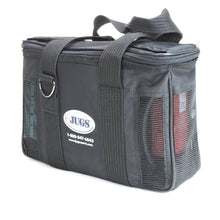 A three-quarter view of the black JUGS battery pack case with its handles and shoulder strap, on a white background.
