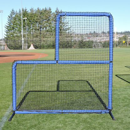 The JUGS Protector Blue Series L-Shaped Pitchers Screen standing on a baseball field.