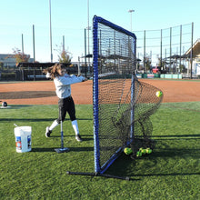 A softball player hitting off a tee into the JUGS Protector Blue Series Square Screen with Sock-Net on turf.