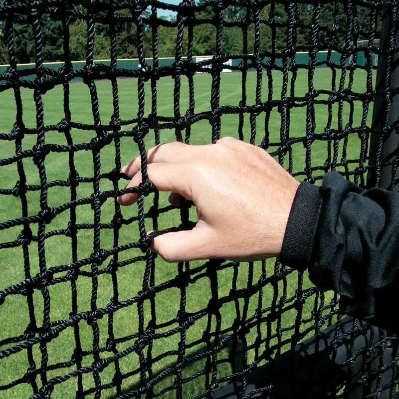 A hand gripping the heavy-duty knotted netting of a JUGS Protector Series screen.