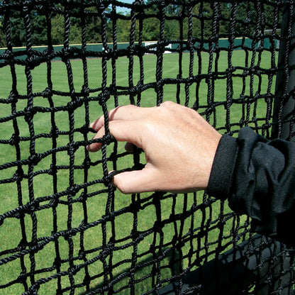 A hand gripping the heavy-duty knotted netting of a JUGS Protector Series screen.