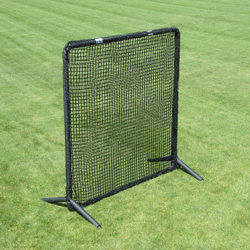 The JUGS Protector Series Square Baseman Screen standing on a grass field.