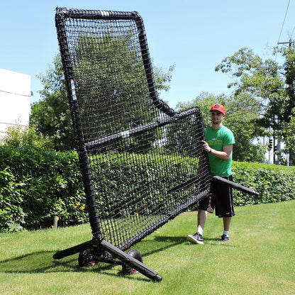 A man rolling a JUGS Protector Series screen on its wheel kit.