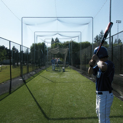 A JUGS batting cage with its galvanized steel outdoor frame installed over turf.
