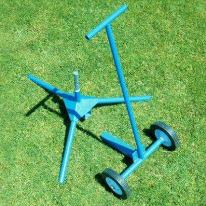 The light blue JUGS transport cart lying on green grass.
