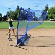 A softball player hitting off the JUGS T into the JUGS Complete Practice Travel Screen on an infield.