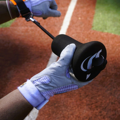 Batting-gloved hands grip a bat with the True Connect attachment in place.