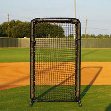 Black padded Pro 6x4 safety screen standing in a dirt infield