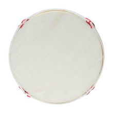 Cross-section of a softball showing its solid polyurethane center