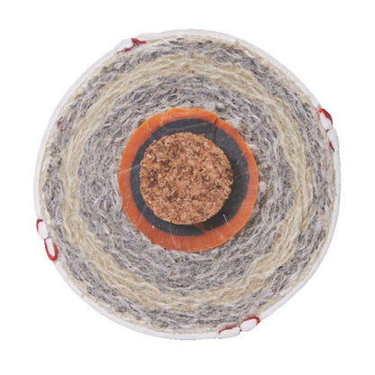 Cross-section of a baseball showing the cushioned cork center and layered wool windings