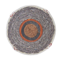 Cross-section of a baseball showing the cushioned cork center and layered wool windings