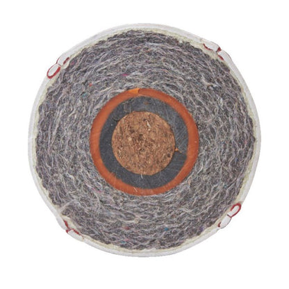 Cross-section of a baseball showing the cushioned cork center and layered wool windings