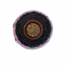 Cross-section of a wet weather baseball showing the shell, windings, and cork center