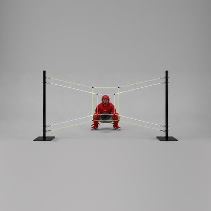 A catcher in red gear crouched behind the string target, framed by the inner white rectangle and the outer yellow rectangle
