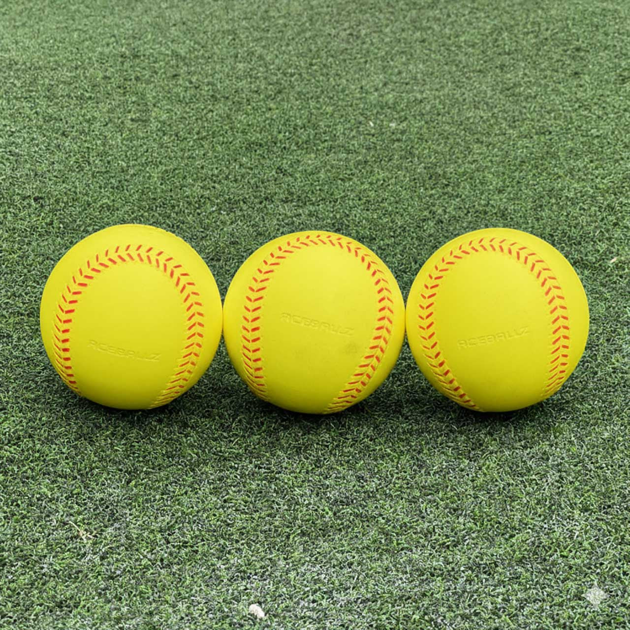 TruFlight AceBallz set of 3 softballs on field grass