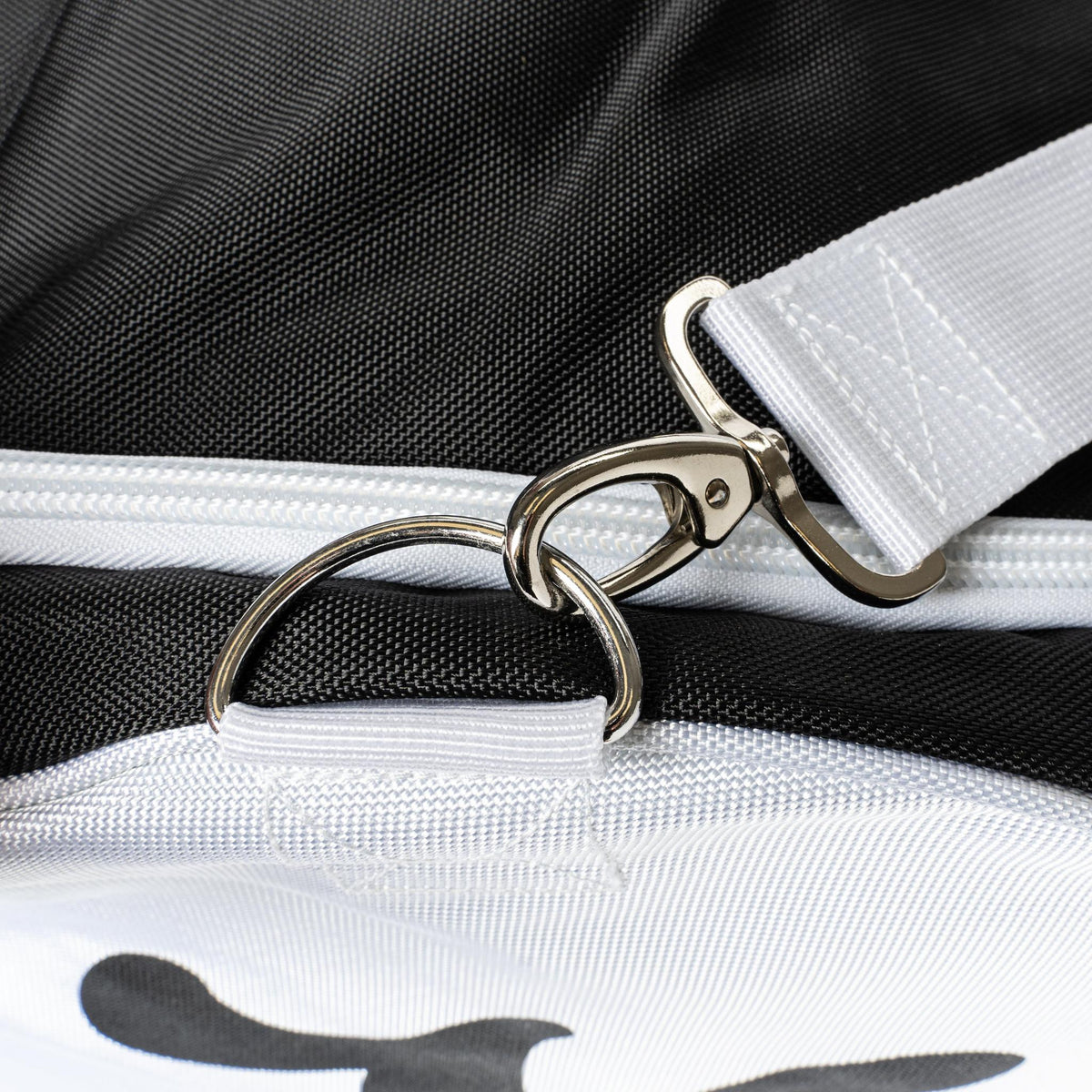 Close up of the Catchers Duffle shoulder strap swivel clip and metal D ring on the black bag