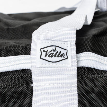 Stitched Valle tab on the white strap of the black Catchers Duffle