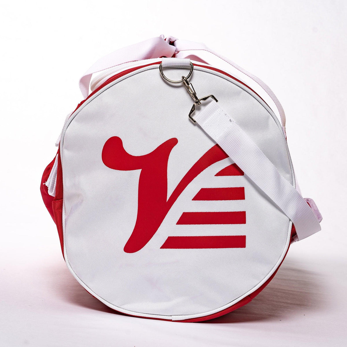 Red Valle Eagle Catchers Duffle Bag end on, white end cap with red Valle V and clipped shoulder strap