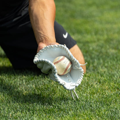 Valle Eagle KK four-finger training glove, close-up of two hands fielding with the flat glove