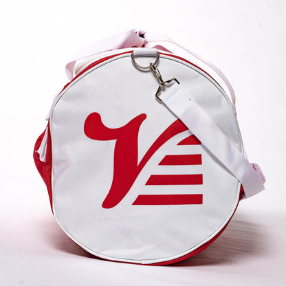 White end cap of the red Players Duffle with the red Valle V logo and clipped shoulder strap