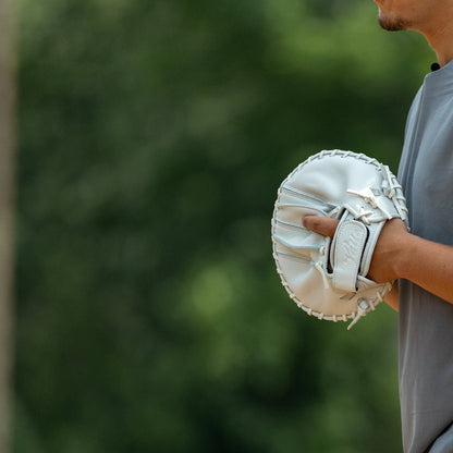 Valle Eagle Switch pancake training glove, a player holding the pancake glove at his side
