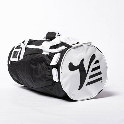 Black Valle Eagle Youth Equipment Bag, three quarter studio view with white end cap and straps