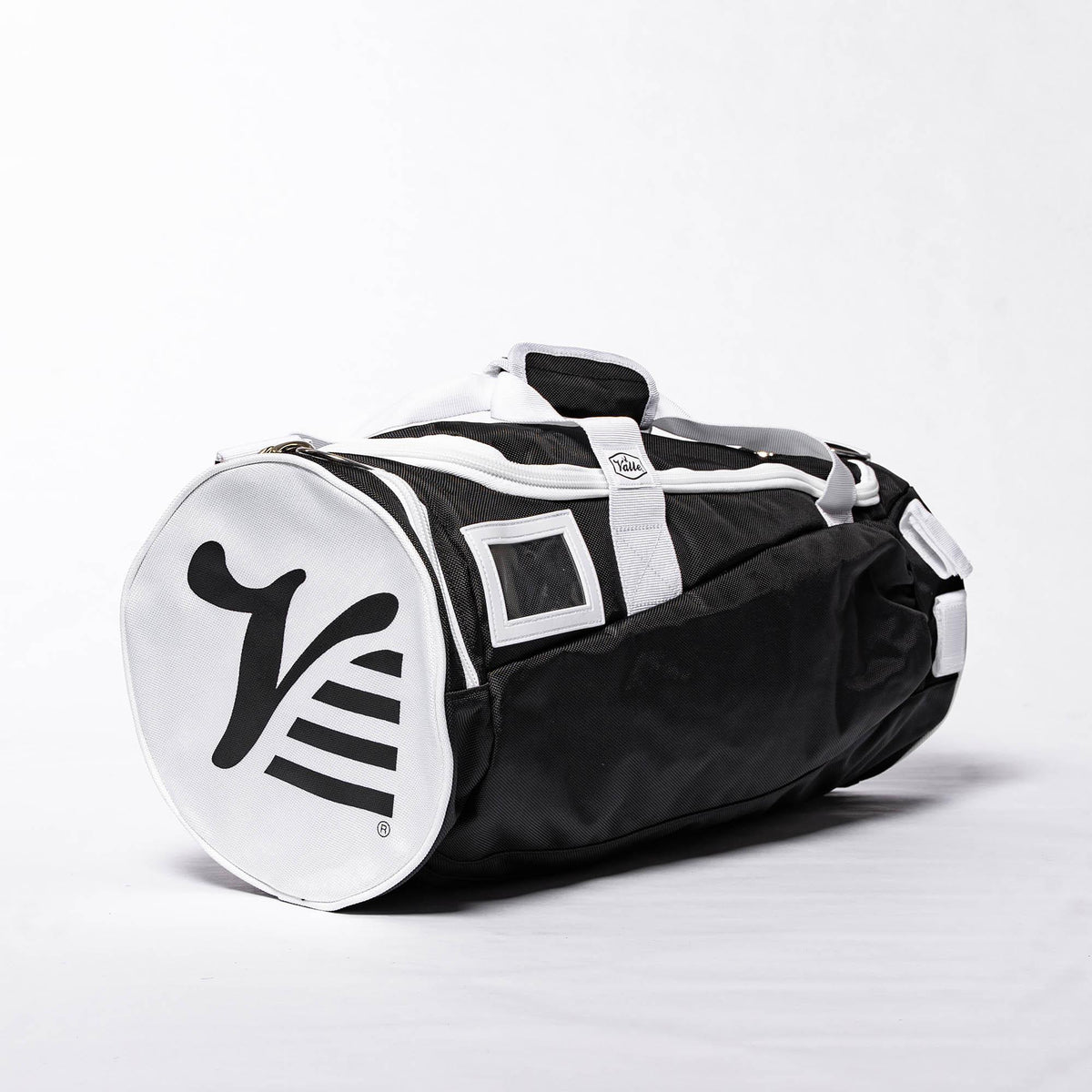 Black Valle Eagle Youth Equipment Bag, studio side view with ID window and white logo end cap